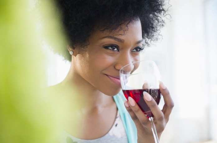 Black Woman Smelling Wine